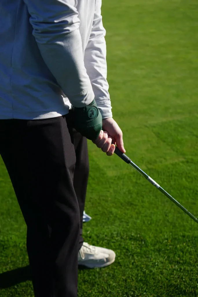 Nova golf glove on the course: forest glove stance