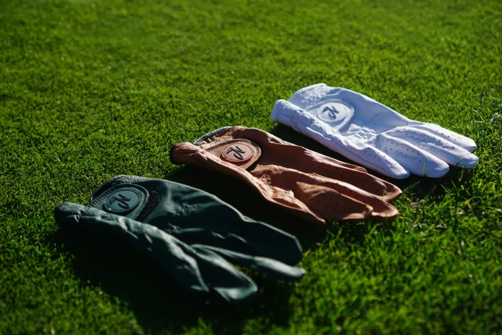 Nova golf glove on the course: gloves flat lay on grass